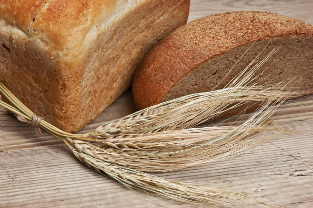 istock wheat bread wheat bread on a wooden table 1209945373