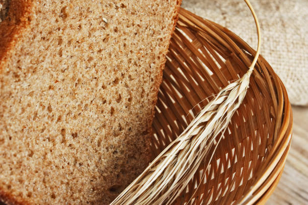istock rye bread and ears of corn in basket 1209946769