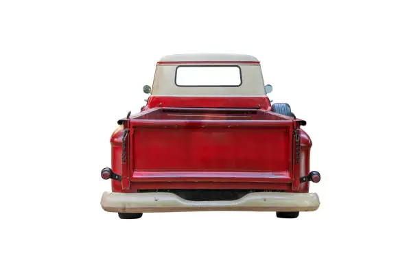 Photo of The back of a vintage red pickup truck,isolated on white background with clipping path