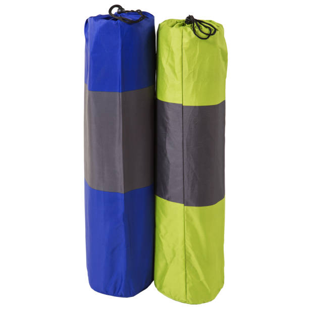 istock two inflatable mats or mattresses, for camping folded into rolls, in covers, stand on a white background 1209947865