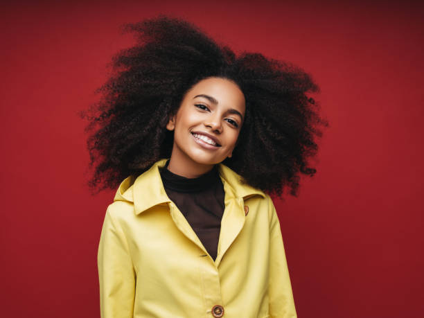 istock Young woman wearing raincoat 1209950169