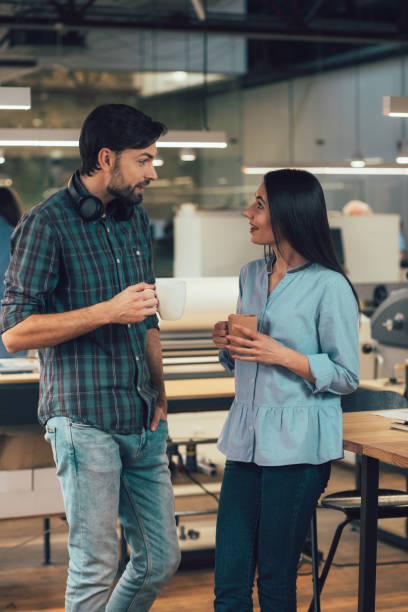 istock Exciting conversation between two colleagues stock photo 1209950886