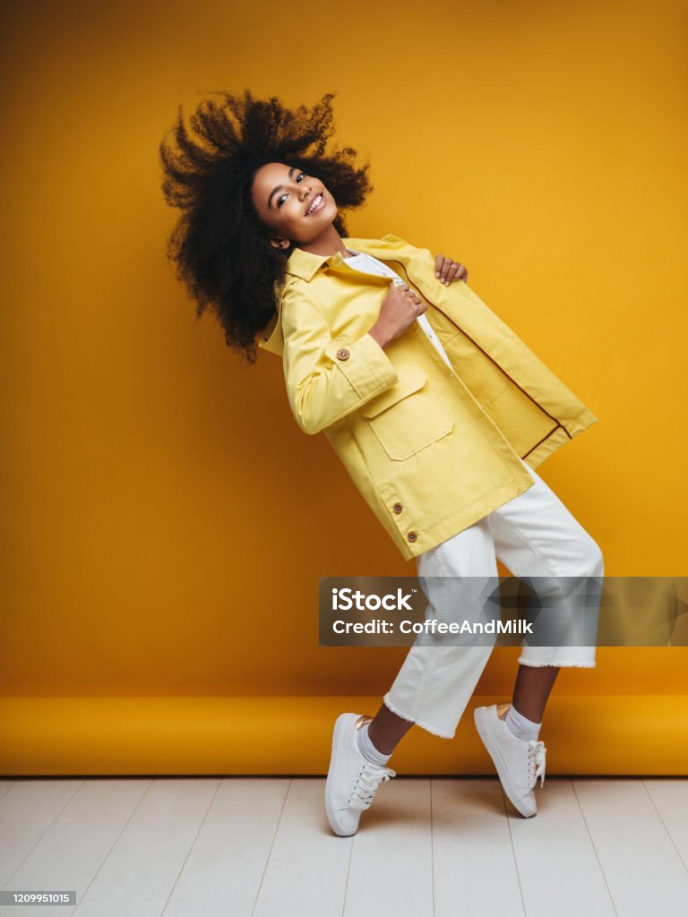 Young woman wearing raincoat Fashion Stock Photo