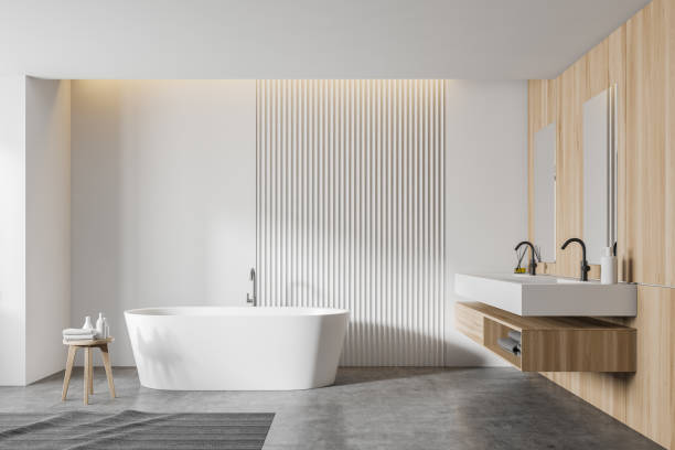 istock White and wooden bathroom interior, tub and sink 1209951201
