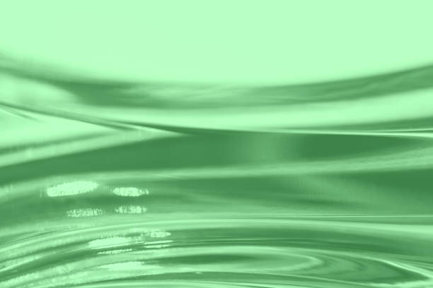 Abstract blurred soft focused futuristic wavy background. Trendy mint colored minimal backdrop. Glass texture