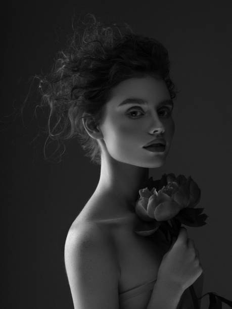 istock Beautiful woman with flower 1209952967
