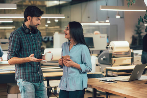 istock Pleasant friendly conversation at work stock photo 1209953017