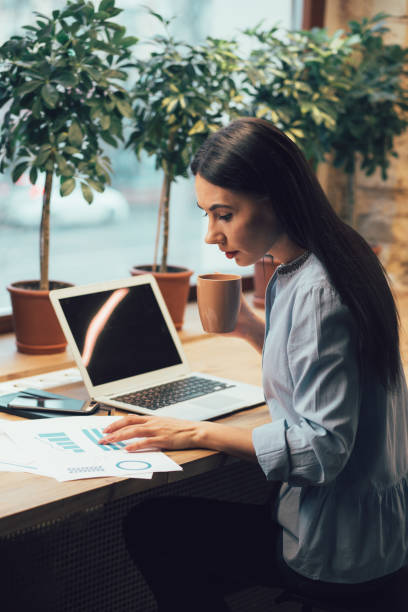 istock Concentrated woman working with graphics stock photo 1209953301