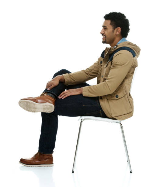 istock Pacific islander ethnicity male resting in front of white background wearing pants 1209954355