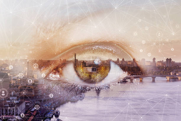 The eye looks into the city network.Double exposure of the eye and the city.