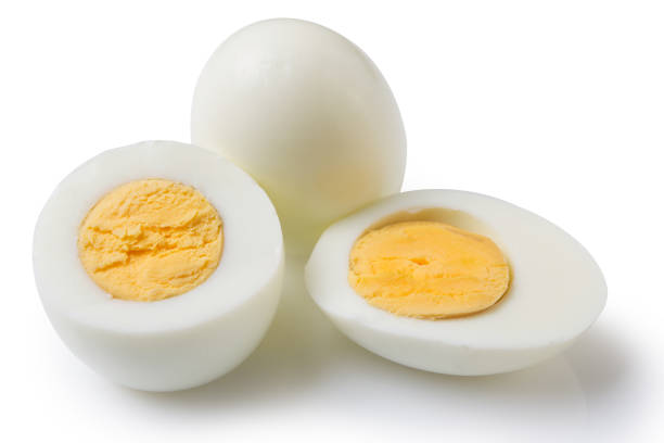 istock boiled peeled eggs on a white background, one whole egg two eggs are cut in half, the yolk is visible 1209955364