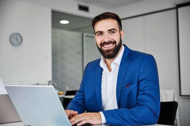 istock businesman office desk laptop computer business corporate 1209957409