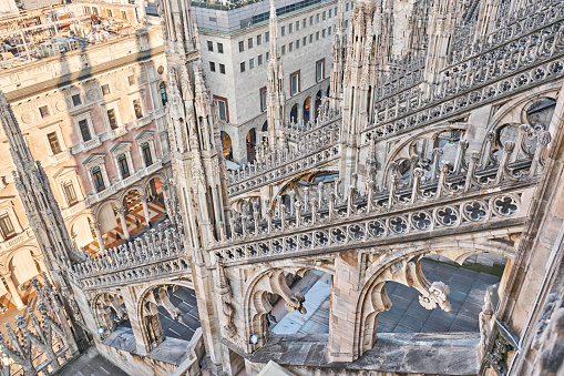 Exterior of the Milan Cathedral (Duomo di Milano). The image shows partially the gothic features of this extraordinary building. The construction began in 1386, and the final details were completed in 1965.