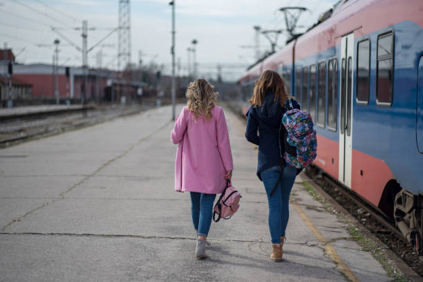 istock Two women passing by the train 1209958633