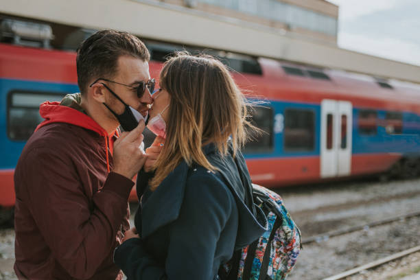 istock Couple meeting at the train station. 1209960025