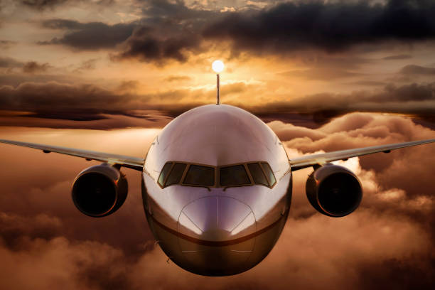 istock Airplane flying above the clouds 1209964261
