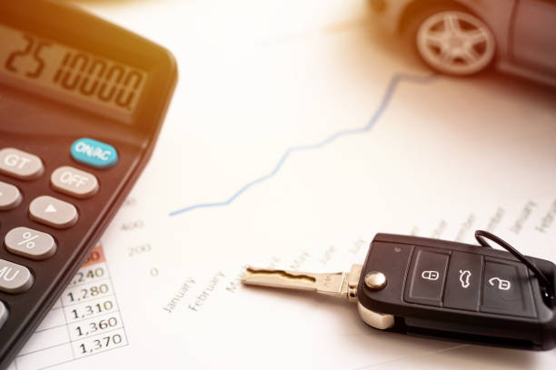 car sales chart concept visual. car keys, graphics and calculator car sales chart concept visual. car keys, graphics and calculator cash for cars stock pictures, royalty-free photos & images