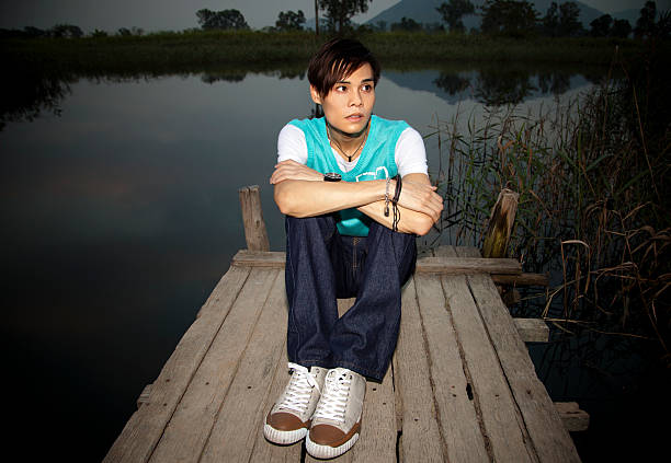 Asian Teenager Posing On The Pier stock photo