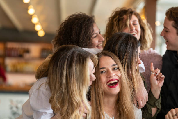istock Happy friends meet in a restaurant. 1209966583