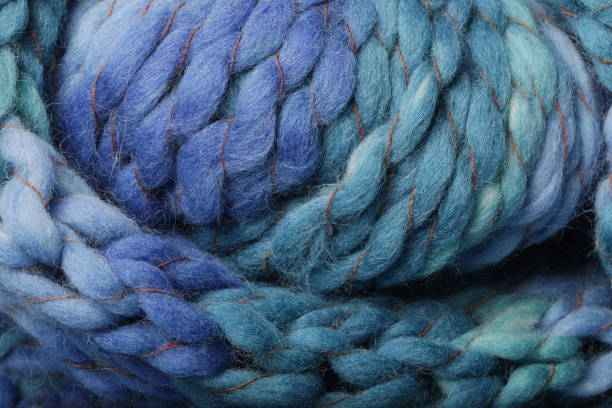 Melange blue knitting texture close up as a background.