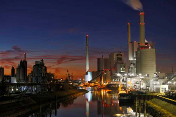 istock Power Plant on a Canal Illuminated at Night 1209968122