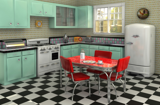 Retro kitchen from the 1950s complete with stove, refrigerator, chrome dinette set, percolator, toaster, bread box and radio