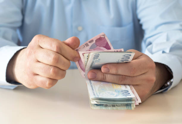 istock The man is counting turkish liras banknote 1209972158
