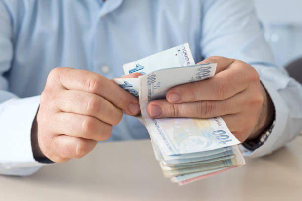 istock The man is counting turkish liras banknote 1209972225