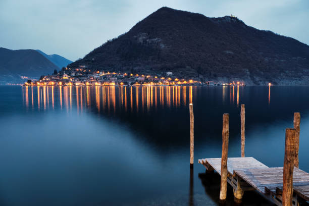 Wooden pier for Monte Isola, Lake Iseo, Lombardy, Italy