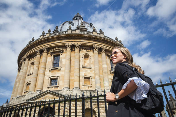 Oxford student going to lectures Female student walking around Oxford with her backpack oxford university photos stock pictures, royalty-free photos & images