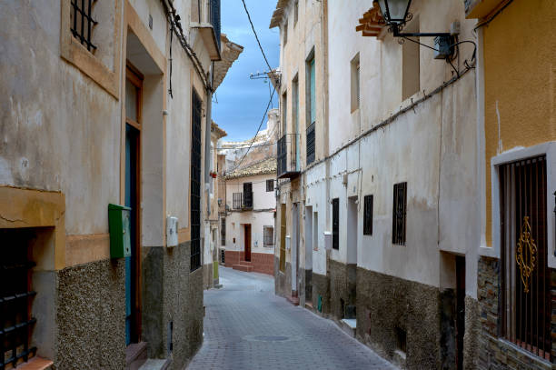 detail of an old and narrow street street with its deteriorated houses in a small town