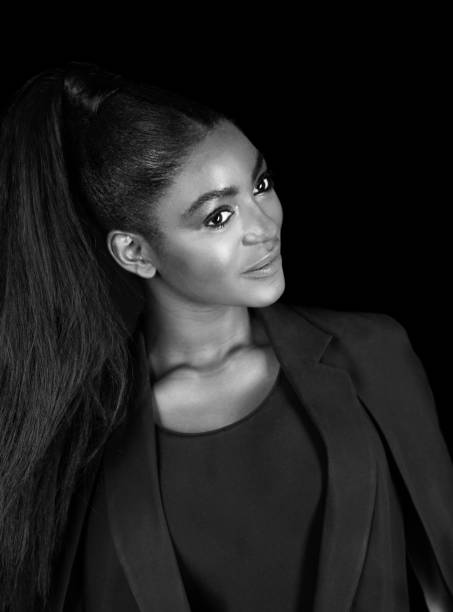 istock Smiling Black woman in studio, B&W 1209980100