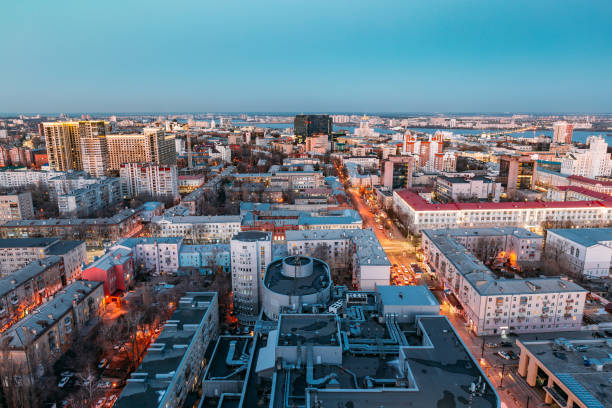 Night Voronezh downtown, aerial view from rooftop Night Voronezh downtown, aerial view from rooftop. panoramic riverbank architecture construction site stock pictures, royalty-free photos & images
