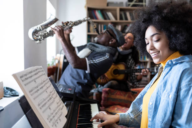 istock Female pianist performing with a group in studio 1209985090
