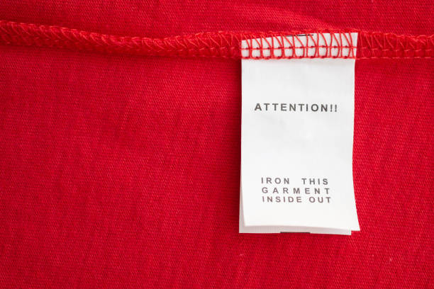 istock White laundry care washing instructions clothes label on red cotton shirt 1209985648