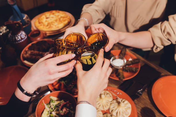 istock Clinking glasses with alcohol and toasting, party. 1209985883