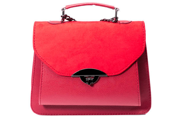 istock women's handbag in red leather and suede, isolated object on a white background. 1209988278