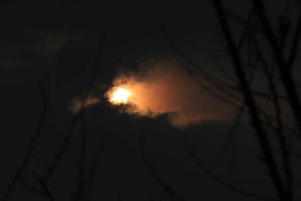 istock The sun behind the black clouds 1209989359