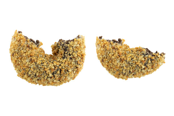 istock half of peanuts coated chocolate doughnut isolated on white background 1209991647