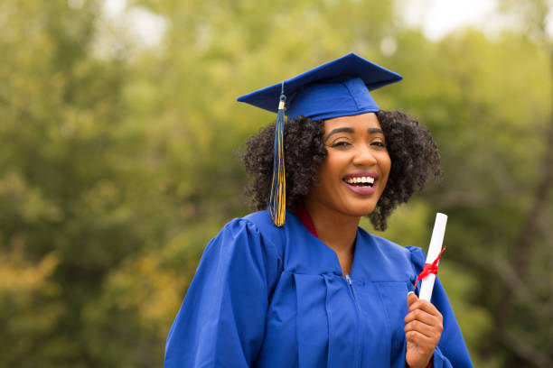 istock Excited young woman on graduation day. 1209997404