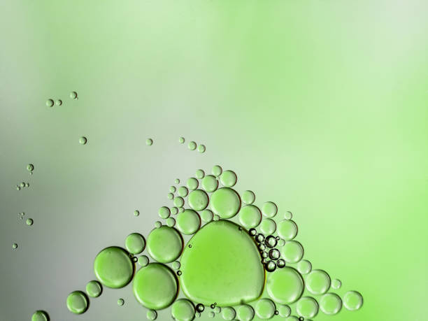 istock oil and water on green 1209999643