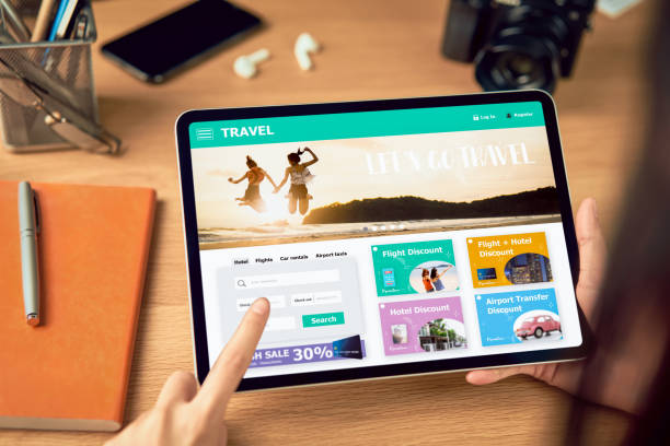 istock Hands holding digital tablet with application booking flight travel search ticket holiday and hotel on website discounted price, concept technology online marketing and promotion. 1210003312