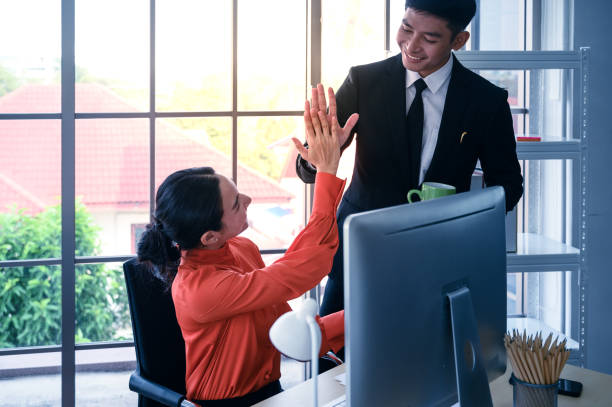istock Business couple working together with computer information at office workplace. 1210006388