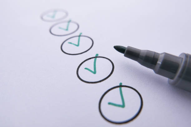 istock close up of check mark with pen on paper 1210007355