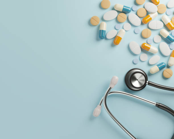 istock Container, scattered pills and stethoscope stock photo 1210011840