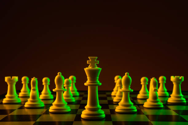 istock Chess pieces on a chessboard, construction, game. The concept of confrontation, career, competition, startup, battle of brains. 1210012035