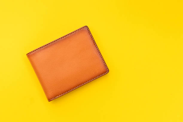 istock New leather brown men wallet on yellow 1210020062