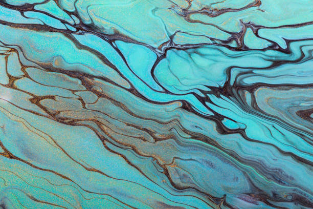 istock Fluid Art. Diagonal mint green waves and gold particles. Abstract marble background or texture 1210020456