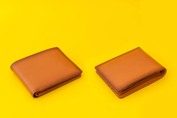 istock New leather brown men wallet on yellow 1210020503