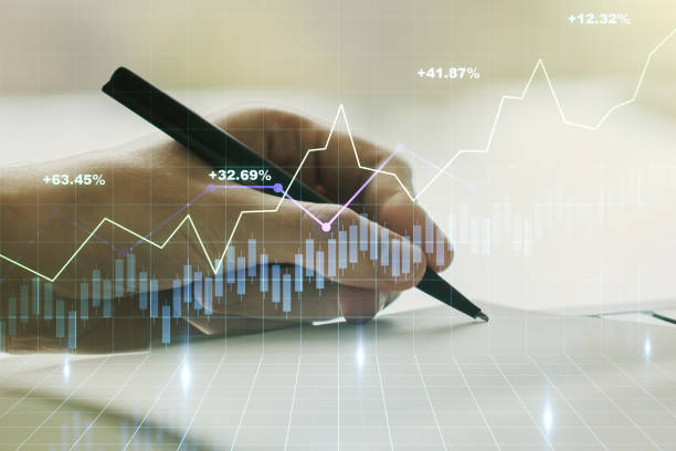 istock Multi exposure of abstract creative financial graph with hand writing in notepad on background, forex and investment concept 1210022046